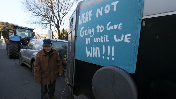 Vincent Black, a farmer from Cavan, among tractors parked on Merrion Square in Dublin city centre