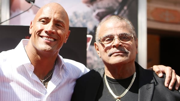 Dwayne Johnson and Rocky Johnson pictured at Dwayne Johnson's hand/footprint ceremony in Hollywood in May 2015