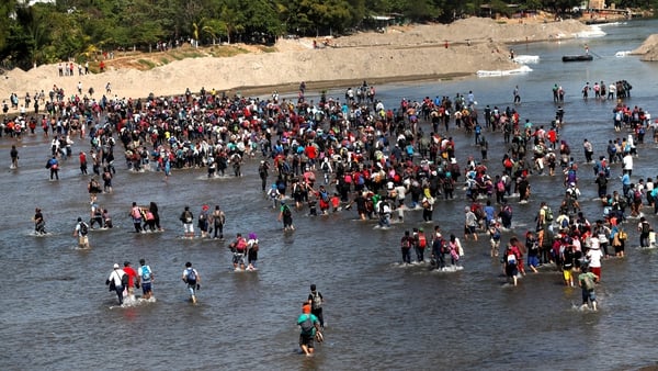 Migrants mostly from Honduras cross the Suichate River on the Guatemala, Mexico border