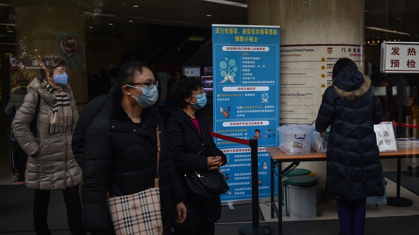 People wear face masks as the SARS-like virus continue to spread