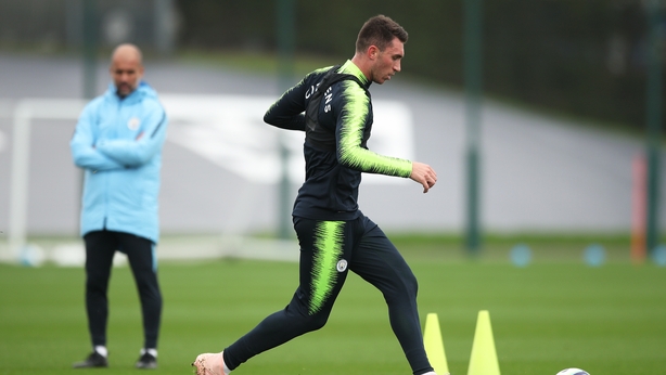 Manchester City's Aymeric Laporte is watched by manager Pep Guardiola during a 2018 training session