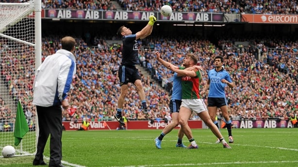 Stephen Cluxton, Aidan O'Shea and Philip McMahon contest a high ball