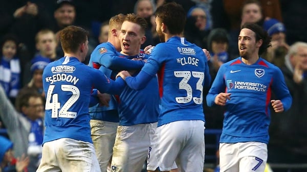 Ronan Curtis is mobbed after scoring for Portsmouth