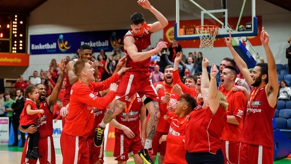 Lorcan Murphy of Griffith College Templeogue celebrates with his team-mates after being named MVP