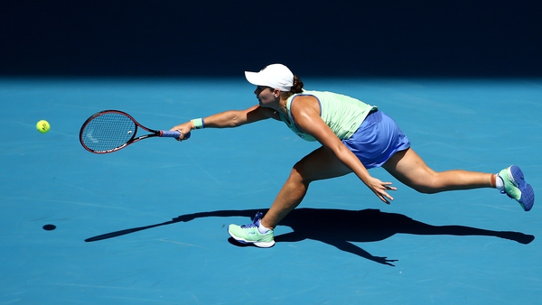 Ashleigh Barty lunges to make a forehand on Rod Laver Arena