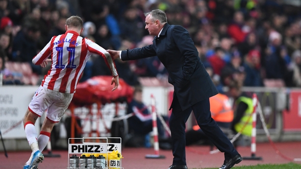 James McClean and manager Michael O'Neill in action for Stoke City