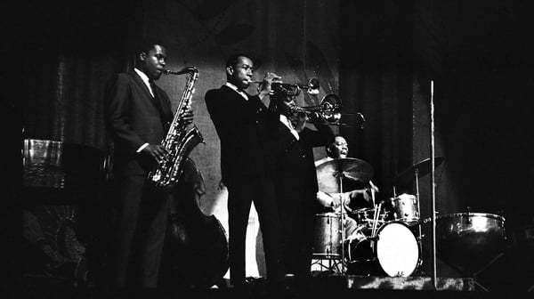 Tenor saxophonist Wayne Shorter, trumpeter Freddie Hubbard, trombonist Curtis Fuller with bandleader/drummer Art Blakey at the Apollo Theater in Harlem, New York in 1964