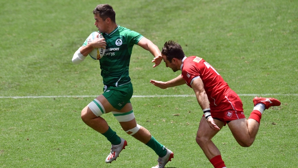 Ireland's Bryan Mollen rounds Pat Kay of Canada in the Sydney Sevens