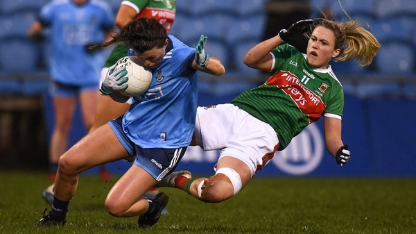 Leah Caffrey of Dublin ships a tackle from Fiona Doherty of Mayo at MacHale Park.