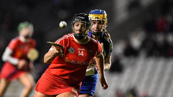 Linda Collins of Cork tries to evade Waterford's Kate McMahon during their National Camogie League Division 1 clash at at Páirc Uí Chaoimh.