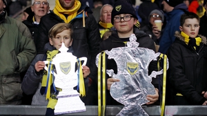 Oxford United supporters hold up home-made FA Cup replicas