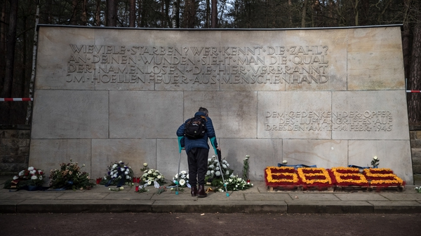 A man stands in front of the memorial to commemorate the 75th anniversary of the destruction of Dresden