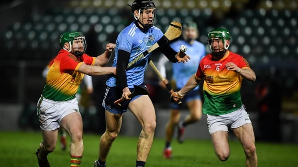 Dublin's Ronan Hayes hassled in possession by Carlow's Gary Bennett and David English