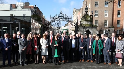 TDs gathered at the gates of Leinster House