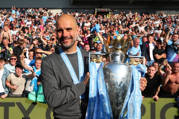 Guardiola with the Premier League trophy last May.