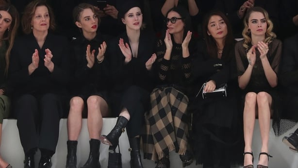 From left, Sigourney Weaver, Maya Hawke, Rachel Brosnahan, Demi Moore, and Cara Delevingne applause at the end of the Dior fashion collection during Women's Fashion Week Fall/Winter 2020/21 presented in Paris (AP Photo/Thibault Camus/PA)