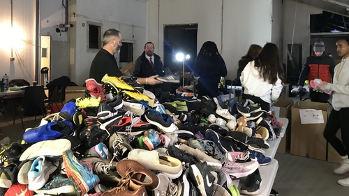The campaign has been inundated with pairs of shoes, runners and boots - all to be sent to South African children