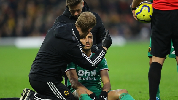 Romain Saiss of Wolverhampton Wanderers is tested for concussion after a clash