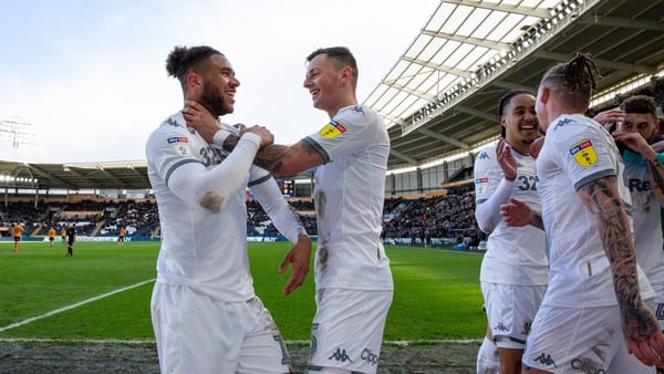 Leeds' Tyler Roberts celebrates scoring his side's fourth goal with Ben White