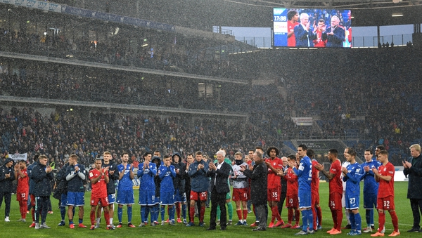 Karl-Heinz Rummenigge and Dietmar Hopp come together with players to applaud the home fans