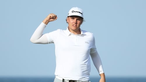 Sami Valimaki of Finland celebrates after a putt on the 18th