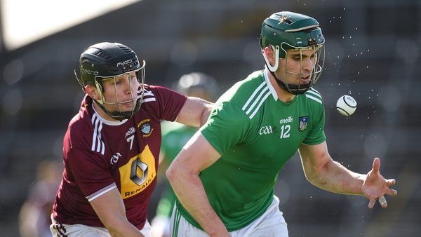 Limerick's Brian Ryan gets past Liam Varley