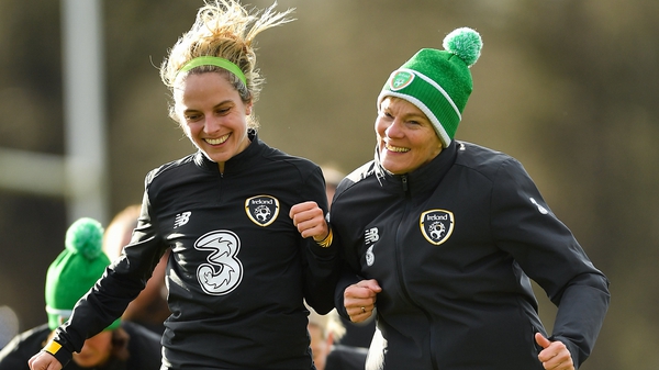 Julie-Ann Russell (L) and manager Vera Pauw bump shoulders in training