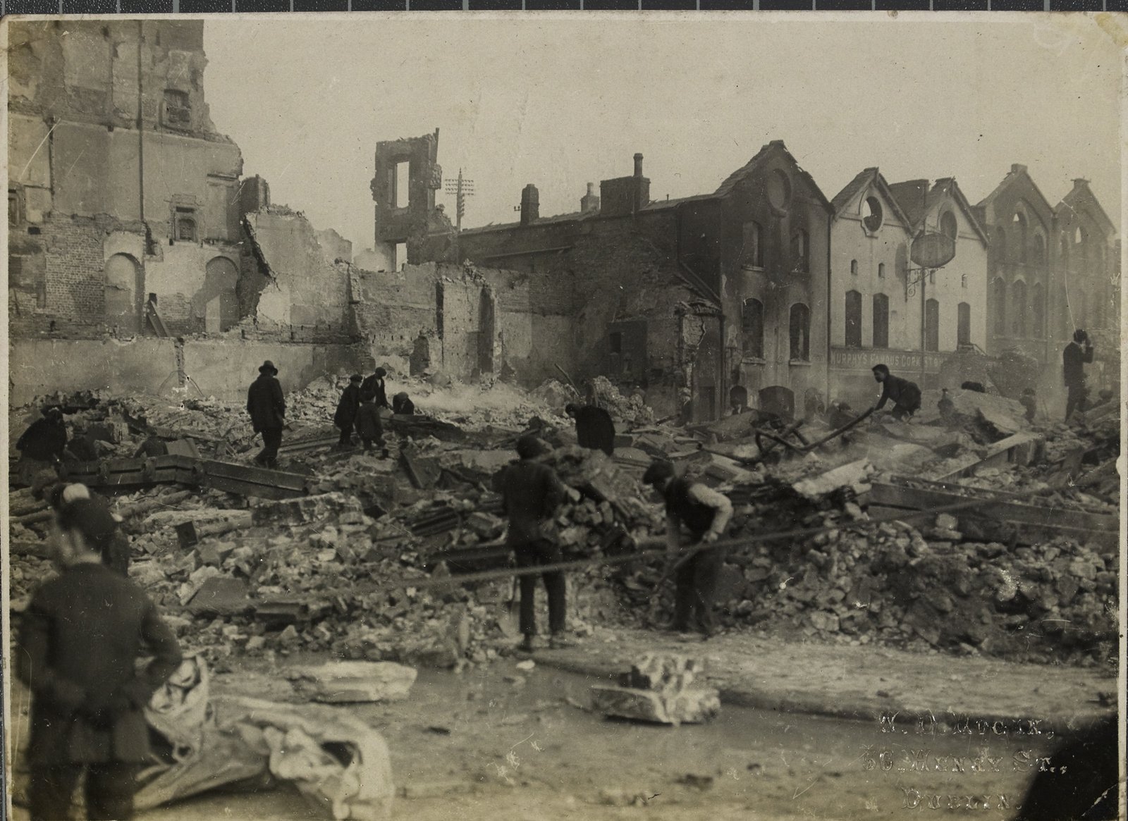 Image - The rubble of Cash's department store on Patrick Street after the burning of the city. Image courtesy of the National Library of Ireland