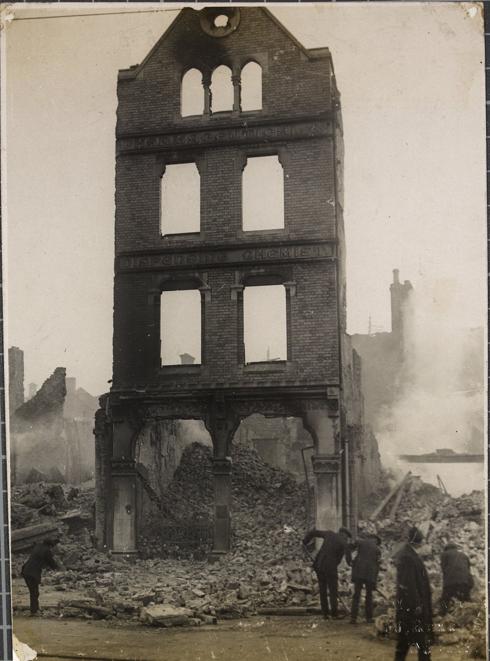 Image - The remains of Sunner's Pharmaceutical and Dispensing Chemist, 31 Patrick Street, Cork as they were on 13th December 1920. Image courtesy of the National Library of Ireland