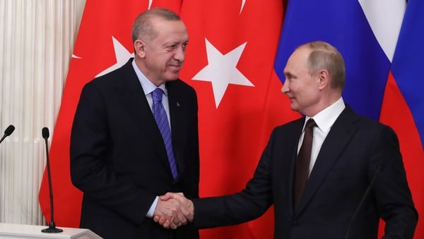 Russian President Vladimir Putin and Turkish counterpart Recep Tayyip Erdogan shake hands at a press conference