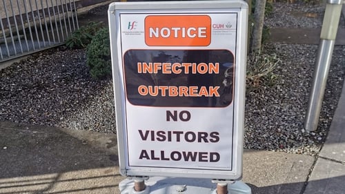 A sign outside Cork University Hospital warning visitors about the virus