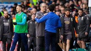 Leeds United manager Marcelo Bielsa comforts Huddersfield Town manager Danny Cowley after the match