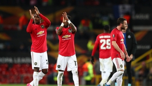 Fred and Odion Ighalo of Manchester United applaud the fans during the UEFA Europa League round of 32 second leg match against Club Brugge