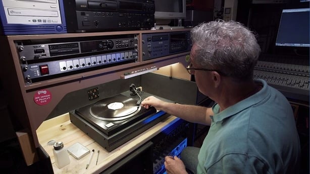 Sound engineer playing acetate disc