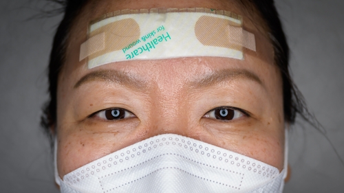 The pads, plasters and tape protect their faces from painful sores that can develop as they tend to coronavirus patients