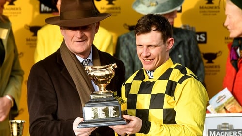 Paul Townend (R) celebrates with Willie Mullins after winning the Gold Cup