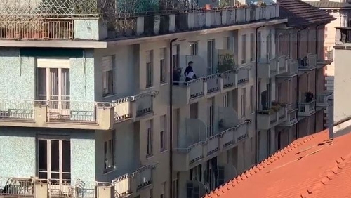 Attempts to boost morale have come in the form of music and singing at windows (Courtesy: Niccolo Zancan)