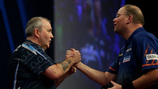 Phil Taylor (L) and Raymond van Barneveld look set for another clash
