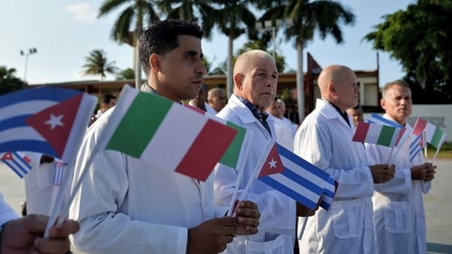 Doctors and nurses from Cuba's Henry Reeve International Medical Brigade are bid farewell before they travel to Italy to help in the fight against the coronavirus pandemic