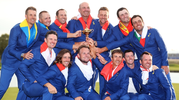 Tommy Fleetwood (front row, 2nd from L) and his 2018 Ryder Cup team-mates with the trphy