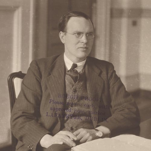 Ernest Blythe sitting at his desk. Image courtesy of the National Library of Ireland