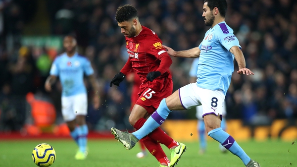 Ilkay Gundogan and Alex Oxlade-Chamberlain vie for possession during Liverpool's 3-1 league win in November