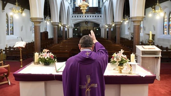 Fr Martin Cosgrove saying mass in an empty Church of the Annunciation in Rathfarnham in Dublin which was transmitted live online. Photo: Aidan Crawley/EPA-EFE