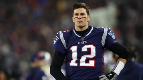 New England Patriots quarterback Tom Brady (12) sails after being