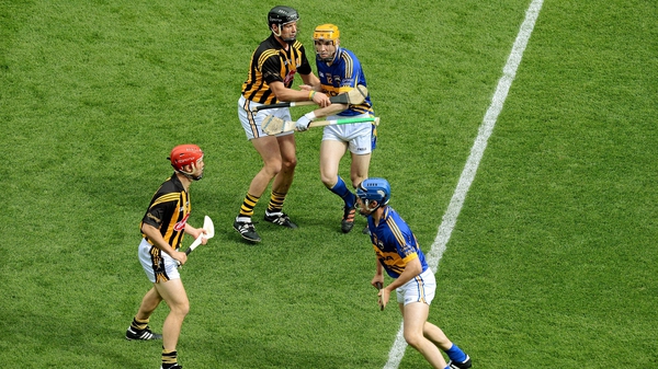 Jackie Tyrrell (top left) tries to politely dissuade Lar Corbett from following Tommy Walsh, (bottom left) in the 2012 semi-final