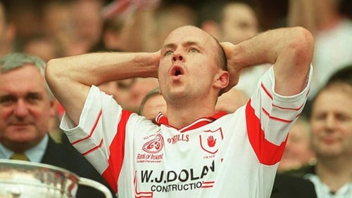 Peter Canavan prepares to lift the Sam Maguire Cup in 2003