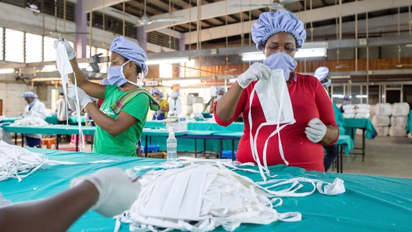 Workers make facemasks at a factory in Accra, Ghana