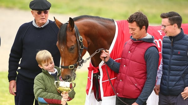 Joseph O'Brien (R) with Rekindling and owner Lloyd Williams (L) after the horse's Melbourne Cup win in 2017