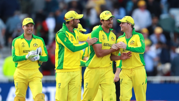 Nathan Coulter-Nile (C) of Australia is congratulated by team mates after their victory during the Group Stage match of the ICC Cricket World Cup 2019
