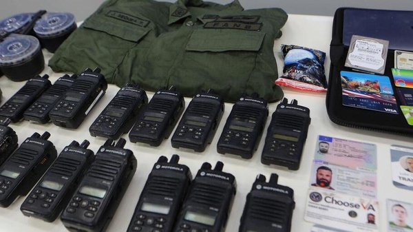 Authorities showed ID cards and equipment of people linked to the operation